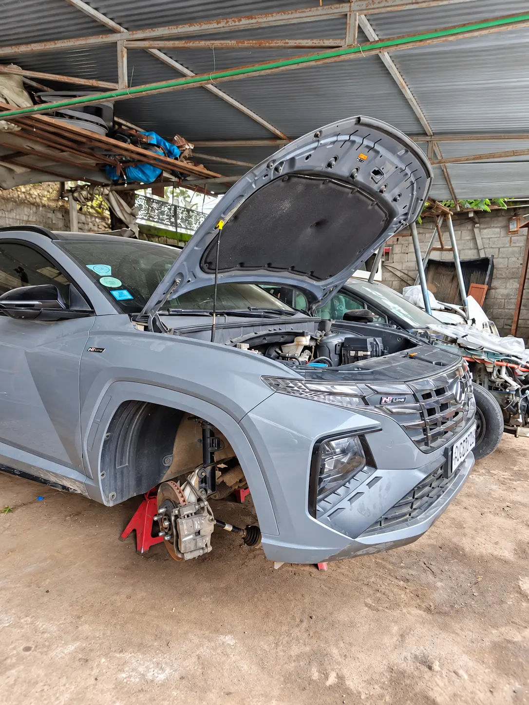 SUV raised on stands for inspection — photo from the Felege Garage workshop