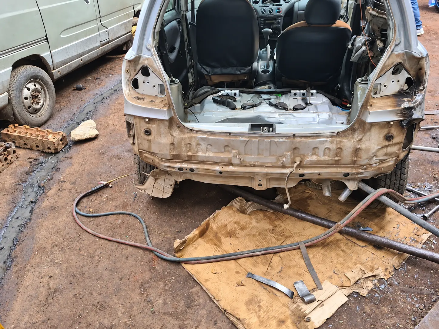 Rear bodywork stripped for repair — photo from the Felege Garage workshop