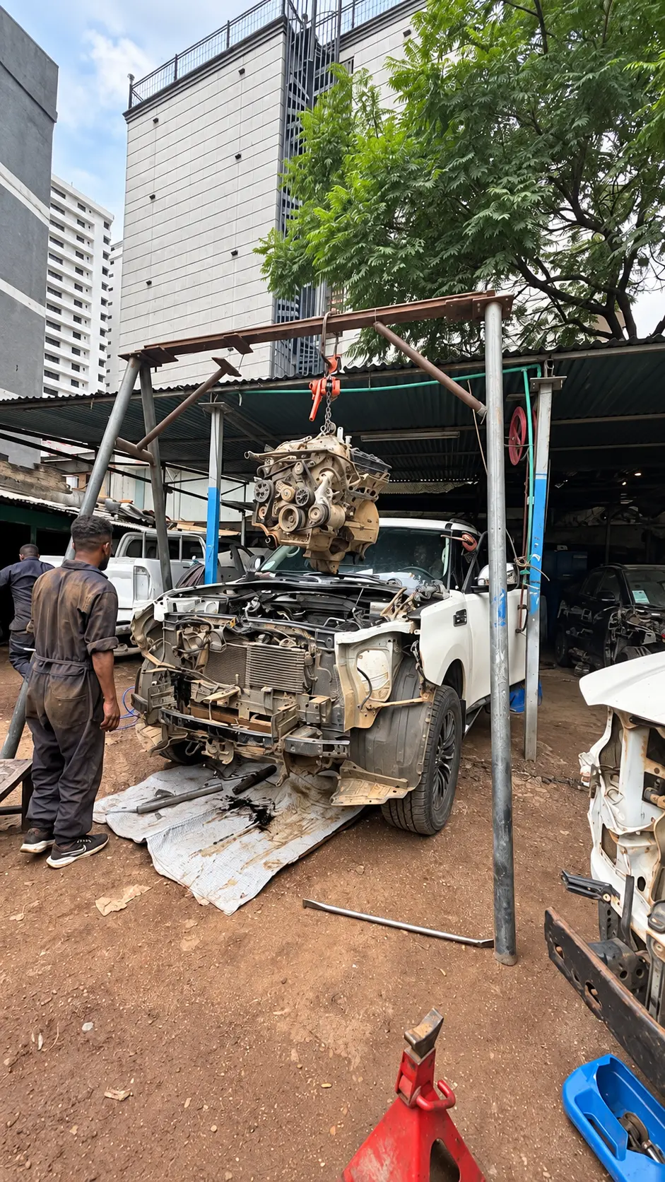 Engine lifted out with the workshop crane — photo from the Felege Garage workshop
